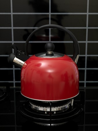 A stove top kettle on a stove topの写真素材