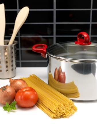 Pasta and a cooking pot ready for cookingの写真素材