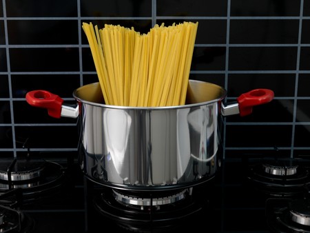 Fettuccine pasta in a cooking pot ready for cookingの写真素材