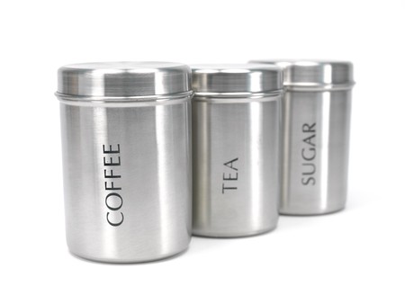 Tea coffee and sugar cannisters isolated against a white background