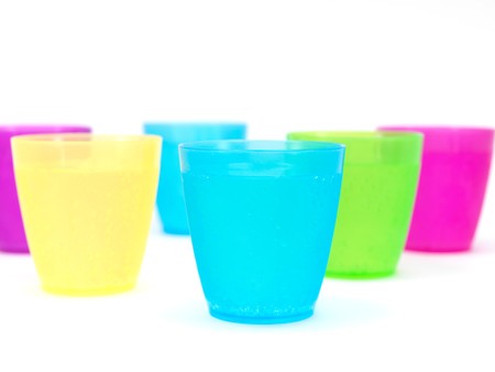 Plastic cups filled with carbonated water isolated against a white backgroundの写真素材