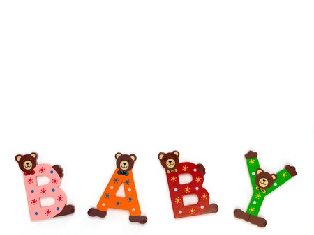 Wooden letters spelling baby isolated against a white backgroundの写真素材