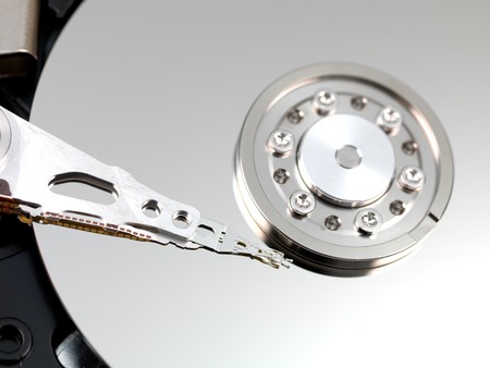 An internal computer hard drive isolated against a white background
