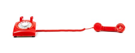 A rotary telephone isolated against a white backgroundの写真素材