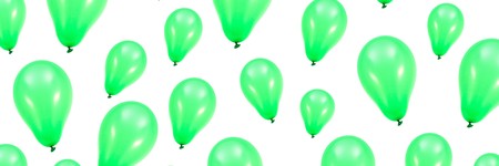 A green balloon isolated against a white backgroundの写真素材