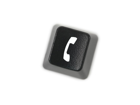 A keyboard key isolated against a white backgroundの写真素材