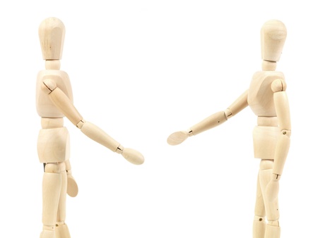 A wooden mannequin isolated against a white background