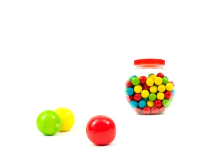 Gumballs in a jar isolated against a white backgroundの写真素材