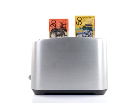 A toaster popping up an Australian twenty dollare note の写真素材