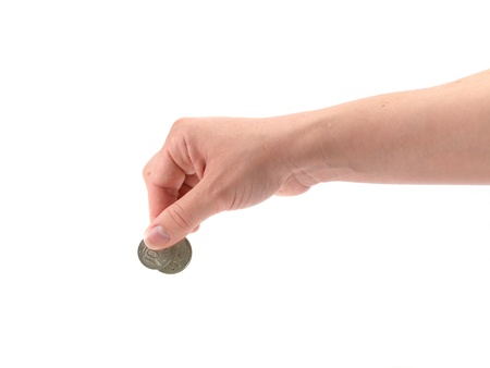 A female hand with coin isolated against a white background