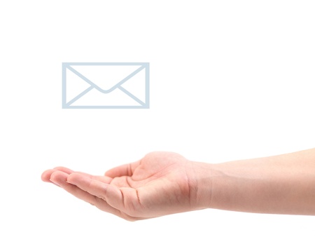 A female hand recieving mail isolated against a white backgroundの写真素材