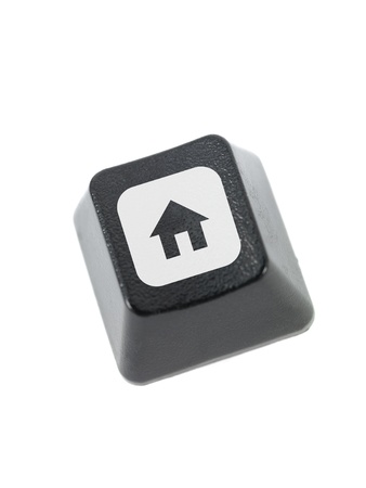 A keyboard key isolated against a white backgroundの写真素材