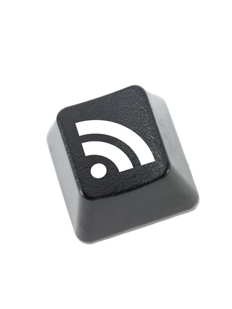 A keyboard key isolated against a white backgroundの写真素材