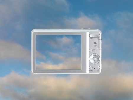 A compact camera with a photo of a blue skyの写真素材