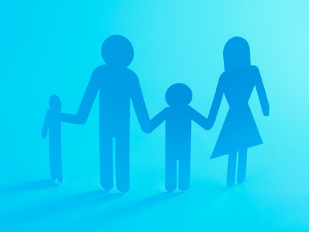 A family cutout shape isolated against a blue backgroundの写真素材