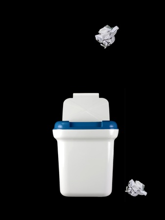 A rubbish bin isolated against a black backgroundの写真素材