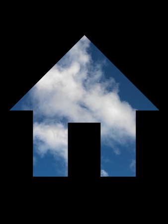 A house symol cut out with a blue skyの写真素材
