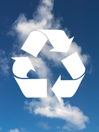 A recycle symbol cutout on a blue skyの写真素材
