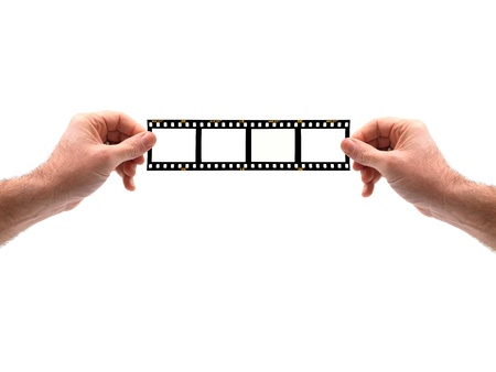 Hands isolated against a white background with a film stripの写真素材