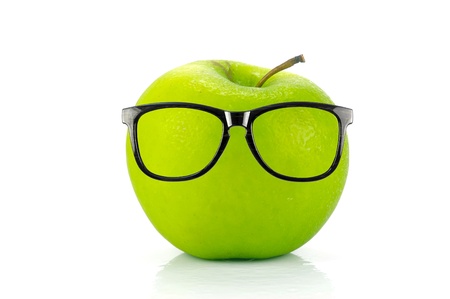 A green apple isolated against a white backgroundの写真素材