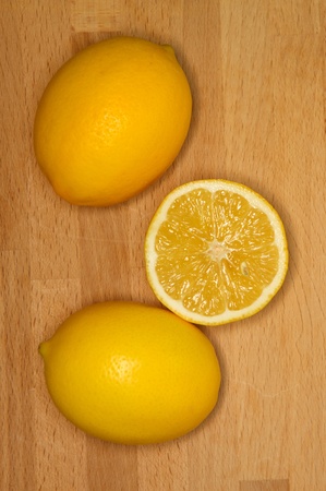 Fresh lemons on a wooden benchの写真素材