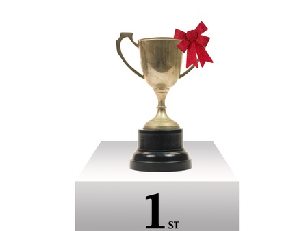 An old tarnished trophy isolated against a white background