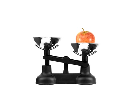 Kitchen balance scales isolated against a white backgroundの写真素材