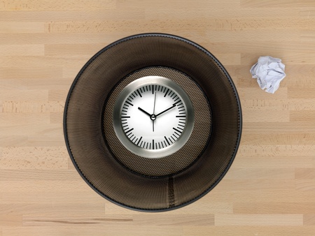 A trash bin isolated on a wooden floorの写真素材