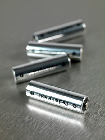 Rechargeble batteries isolated against a silver backgroundの写真素材