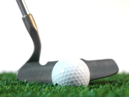 Golfing equipment on artficial grass outdoors
