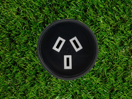 Conceptual renewable images isolated against artificial lawnの写真素材