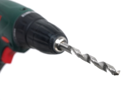 A cordless power drill isolated on whiteの写真素材