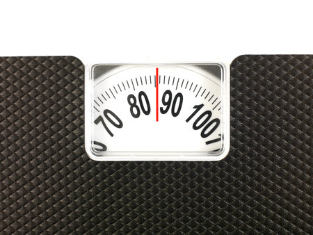 A conceptual dieting image using bathroom scales