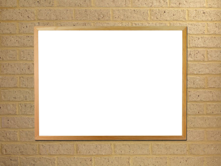 A black board mounted on a brick wallの写真素材