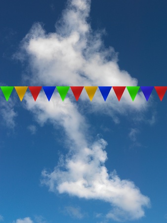 Bunting flags isolated against a blue skyの写真素材