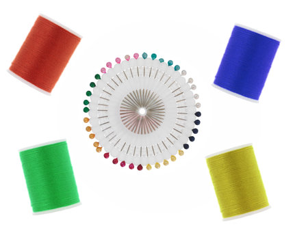 Sewing equipment isolated against a white background