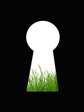 A keyhole isolated against a black backgroundの写真素材