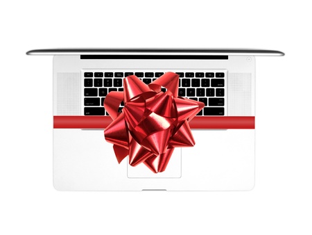 A laptop computer on a work deskの写真素材