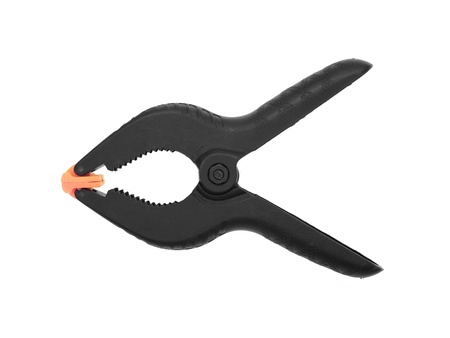 A black clamp isolated against a white backgroundの写真素材