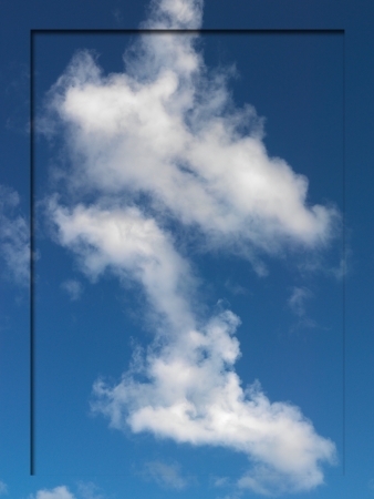 A border imprint on a morning shot of a cloudy blue skyの写真素材