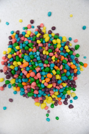 Food decorating sprinkles isolated on a kitchen bench