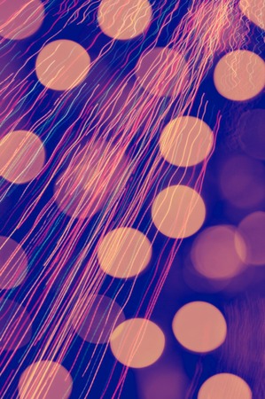 An abstract image of christmas lights blurredの写真素材
