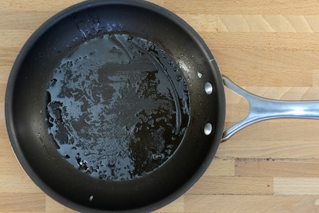 A close up shot of a kitchen frying panの写真素材