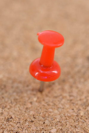 A close up shot of a notice board pins