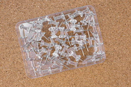 A close up shot of a notice board pins