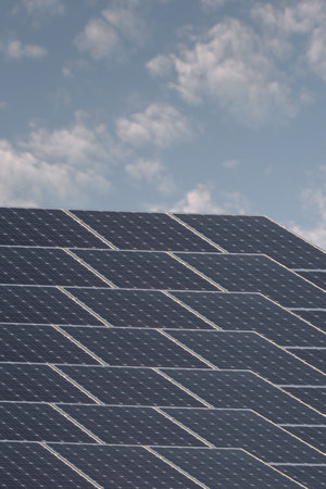 A shot of solar panels of a tiled roof