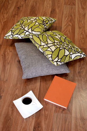 A close up shot of a reading book and a cup of coffeeの写真素材