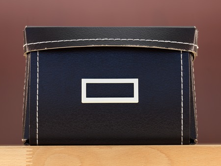 Storage boxes isolated on a wooden shelfの写真素材