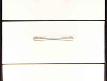 A close up shot of a set of office drawersの写真素材