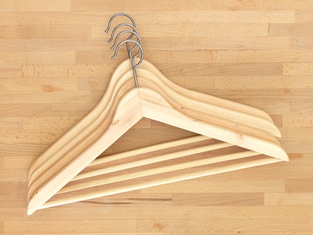 A close up shot of wooden clothes hangersの写真素材